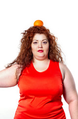 the fat woman with orange juice vegetable fruit holding isolated on the white background