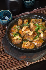 japanese cuisine. hot plate chicken on the background