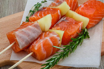 Raw salmon skewers