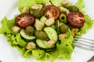 salad with vegetables, olives and chicken