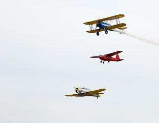 Fototapeta na wymiar three airplanes during acrobatic manoeuvres