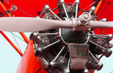 big propeller of a red airplane at the airport