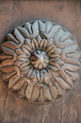 Decorative rosette on the front door in the Italian style