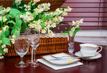 set of dishes and jasmine flowers