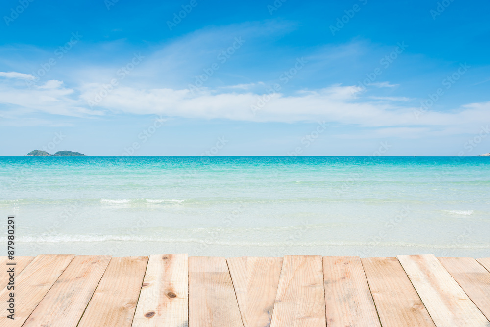 Wall mural wood terrace on beach blue sky