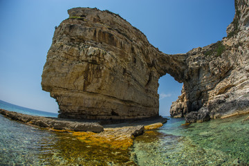Unique and scenic arch in the cliffs, Paxi, Greece