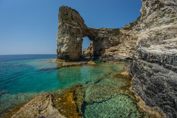 Unique and scenic arch in the cliffs, Paxi, Greece