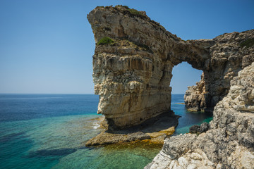 Unique and scenic arch in the cliffs, Paxi, Greece
