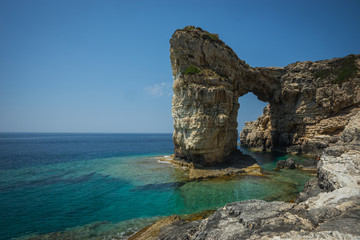 Unique and scenic arch in the cliffs, Paxi, Greece