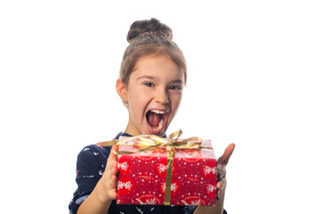 Female child receives a gift surprised and glad.