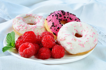 Fresh raspberries vanilla and raspberry flavored  mini donuts with topping