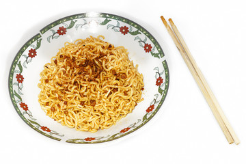 instant fried noodles in plate isolated on white background.