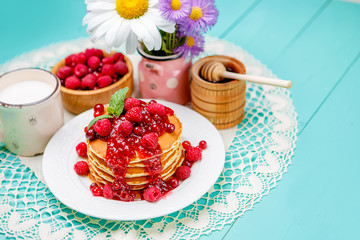 Stack of pancakes on wooden background