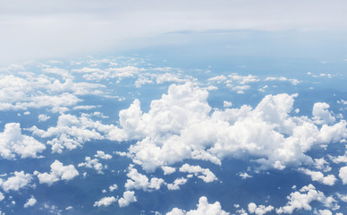 white clouds and blue sky, take a picture on the airplane.