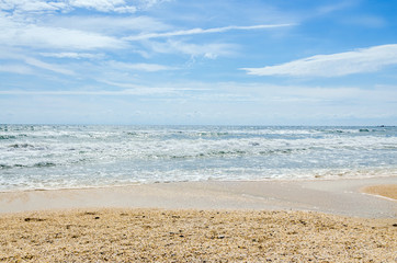 Fototapeta na wymiar The Black Sea beach with sand and water, blue sky clouds, seaside