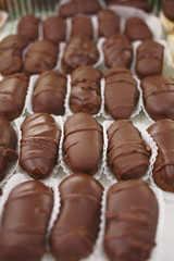 Sweet mini cakes/Sweet mini cakes filled with chocolate and cream. Sweet food. Very shallow depth of field for soft background