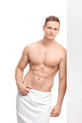 Handsome man with a bath towel around his waist
