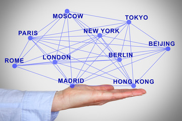 Hand holding network with city names