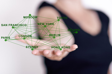 Hand holding network with city names