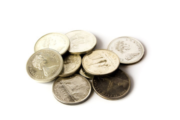 Some silver canadian dollars isolated on white