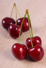 Fresh cherries on wooden table, healthy food