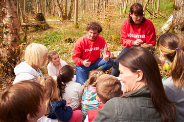Adults And Children Examining Bird's Nest At Activity Centre