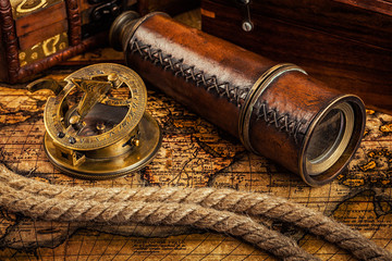 Old vintage compass on ancient map