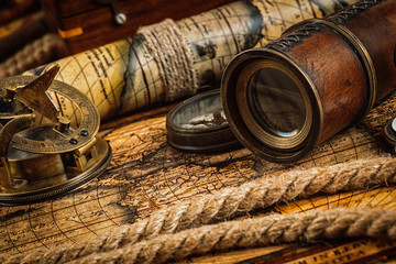 Old vintage compass on ancient map