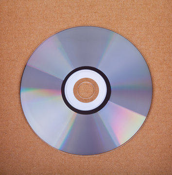 Blank Compact disc CD or DVD on brown paper