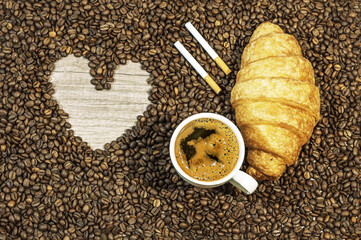 Coffee bean background with heart and cup of fresh hot coffee, t