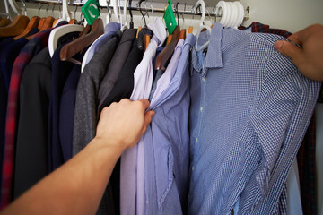 Point Of View Image Of Man Choosing Clothes From Wardrobe