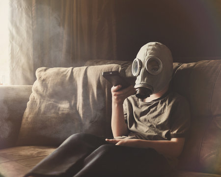 Boy Wearing Gas Mask for Clean Air in Home