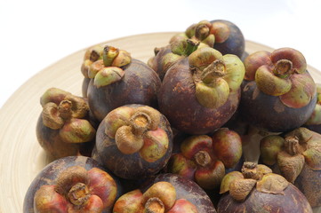 mangesteen fruit purple violet background concept