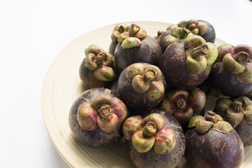 mangesteen fruit purple violet background concept