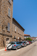 Street view with parked cars. Sartene, Corsica