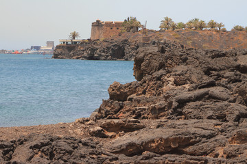Fototapeta na wymiar Stiffened lava on coast of sea gulf. Arrecife, Lanzarote, Spain