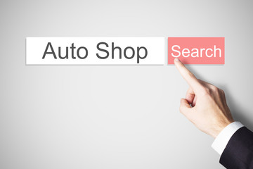 businessman pushing red web search button auto shop
