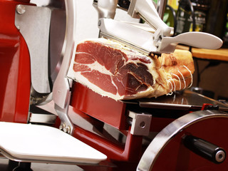 slicer with a piece of smoked ham
