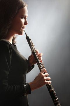 Oboe player oboist playing music instrument