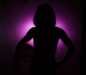 
Silhouette of a girl with ball.
