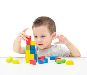 Child Playing Toys Blocks. Isolated White Background.