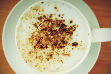 Message in coffee cup that says coffee break