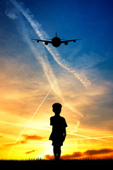 Fototapeta na wymiar child looking the airplane