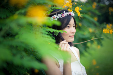 Young woman with a crown of flowers