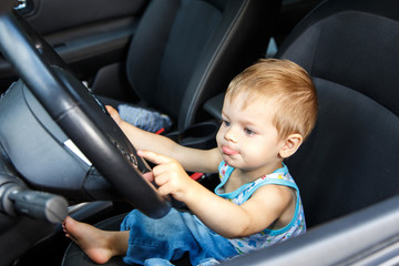 Gifted small kid drives real car