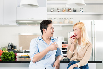 Asian couple having breakfast together