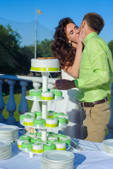 Bride and groom cutting wedding cake