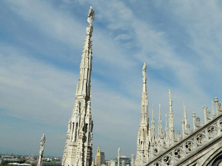 Fototapeta na wymiar Milan Duomo spires on cloudy day.
