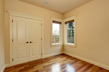 Unfurnished room with hardwood floor.