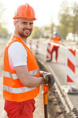 Smiling adult construction worker